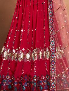 Indulge in the timeless elegance of a rani pink georgette lehenga, adorned with intricate sequin and embroidery work that radiates sophistication and charm. This lehenga, with its semi-stitched design accommodating sizes up to 42 inches, promises a perfect fit for every body type. The 3.5-meter flair adds a touch of grandeur, making every twirl and movement a mesmerizing sight. Complementing the lehenga is an un-stitched choli material, providing the flexibility to tailor it precisely to your pr Red Georgette Lehenga For Navratri, Pink Georgette Lehenga For Navratri, Red Lehenga With Mirror Work In Chinon, Red Unstitched Mirror Work Lehenga, Pink Georgette Lehenga With Dupatta, Red Georgette Lehenga For Eid, Pink Georgette Lehenga For Diwali, Red Embroidered Georgette Lehenga, Pink Semi-stitched Georgette Lehenga