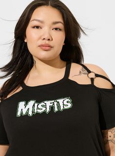 FIT Classic fit: Fitted up top, eased through the body. Measures 24” from shoulder (size 2). MATERIALS + CARE Cotton-blend knit fabric. . 60% cotton, 40% polyester. . Machine wash cold. Tumble dry low. Imported. DETAILS Crew neckline. . Short sleeves. Misfits graphic print. The best plus size women's misfits classic fit cotton o-ring cold shoulder tee graphic tees in deep black made of cotton/polyester. Rock your look from Torrid to Festivals like Coachella and Lollapalooza, a concert, a show, or just for fun! Edgy Cotton Tops For Spring, Edgy Stretch Cotton Tops, Spring Edgy Relaxed Fit Tops, Fitted Wedding Dress, Swim Bottoms, O Ring, Bra Sizes, Cold Shoulder, Knit Fabric