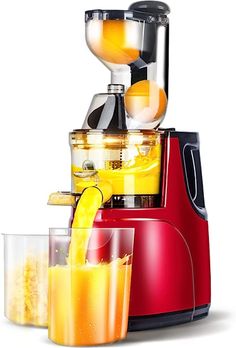 a red juicer filled with lots of oranges