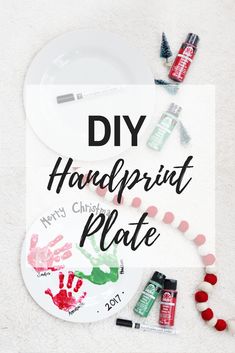 the diy handprint plate is next to some crafting supplies