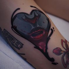 a close up of a person's arm with a tattoo on it and the image of a woman's face