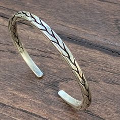 ❋ Handmade Sterling Silver Flexible Braided Cuff Bracelet, Natural look, for Man or Woman ❋Adjustable, Flexible, The Length end to end from the outside) about 6 7/8 inches ( / 17.5cm). ❋Size: M-L for women, S-M for men ❋ Metal Purity: 95% Silver. (Purer than 925 Sterling Silver). We also have Braided Silver Matching Earrings and Rings To browse some more of our silver jewelry collection you can click on the following links: https://www.etsy.com/shop/SilverShapes Earrings: https://www.etsy.com/sh Adjustable Artisan Bangle Cuff Bracelet, Artisan Cuff Bracelets With Adjustable Fit, Artisan Adjustable Cuff Bracelet, Rustic Handmade Cuff Bangle Bracelet, Handmade Rustic Bangle Jewelry, Handmade Rustic Style Bangle Jewelry, Rustic Handmade Bangle Jewelry, Adjustable Oxidized Festival Bracelets, Adjustable Oxidized Finish Bracelets For Festival