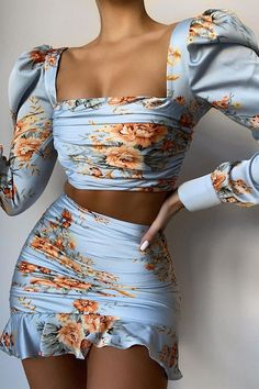 Add some elegance to your wardrobe with this sexy yet chic two-piece dress, crafted from high-quality shiny satin, and printed with an adorable floral design with a blue theme. This co-ord set is featuring a nice square neck crop top with long bishop sleeves with a cuffed end and has a back zipper closure, paired with a sexy high-waisted bodycon skirt with ruffle hems and elastic waistline. Details: Women Set Blue Floral Print Satin Dress High Waist Two Piece Ruffle Squareneck Puffed Bishop Long Co Ords Outfits Two Pieces, Print Satin Dress, Printed Satin Dress, Co Ords Outfits, Skirt Top Set, Blue Floral Print, Neck Crop Top, Dressy Outfits, Wardrobe Style