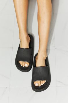 MMShoes Arms Around Me Open Toe Slide in Black
From the pool to the supermarket, these rubber slides are all comfort and all style. Their slide-on design makes them ideal for when you're running late, and their rubber composition makes them the perfect pool companion. Slide these on with a matching lounge set, cutoffs and a tee, or biker shorts and a crop cami.

Type: Slippers
Pattern type: Solid
Style: Casual
Toe: Open toe
Heel height: Flats
Heel shape: Flats
Material: Rubber
Imported Matching Lounge Set, Open Toe Slippers, Blue Zones, Slippers Pattern, Running Late, High Quality Shoes, Cropped Cami, Slide In, Lounge Set