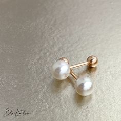 Dainty Pink Tint Genuine Japanese Akoya Pearl 18K Gold Screw back earrings  * Akoya Pearl size: Choice of 3.5-4mm/4.5-5mm/5.5-6mm/6.5-7mm * Screw back gold ball: approx. 3.5mm * Bar thickness: approx. 0.85mm * Metal: 18K Solid Gold choice of Yellow or Rose * Sold as Single or A Pair * Stamp: 18K 📌Production time: If in stock, will ship in 3-5 business days. Usually production time around 2-3 weeks, sometimes can take 3-4 weeks. ❤️Visit our official website for exclusive new products.      https://elekalonjewelry.com/ ❤️Follow us on Instagram @ elekalonjewelry for the latest projects and much more! ❤️If you have any questions, please feel free to message us. Classic White Cartilage Earrings As Gift, White Screw Back Earrings For Gift, Elegant White Round Cartilage Earrings, Elegant White Cartilage Earrings Gift, Elegant White Cartilage Earrings For Anniversary, Dainty Gold Earrings, Akoya Pearl Earrings, Helix Earring, Jewelry Appraisal