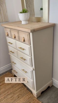 an old dresser has been painted white with gold hardware