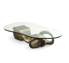 a glass and metal table with wheels on it