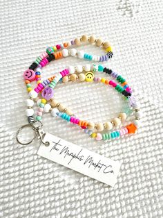 Our colorful + fun lanyards are sure to impress. They are lightweight, durable and here's the BEST PART... no two are ever exactly the same. The beads are pastels and bright happy colors. We mix in wooden and trendy shape beads for a unique vibe! They can be customized upon request with dainty letter beads. Perfect for teachers, students, co-workers, friends or even as a stocking stuffer! Follow me on IG and TikTok @thememphismarketco WHAT YOU WILL RECEVE: 1 colorful beaded lanyard with attachme Cheap Fun Multicolor Lanyards, Cheap Keychain Lanyards For Teacher Appreciation, Cheap Multicolor Beaded Lanyards, Multicolor Lanyards With Key Leash For Everyday Use, Everyday Multicolor Lanyards With Keychain, Trendy Adjustable Lanyards As Gifts, Trendy Multicolor Lanyards For Gifts, Trendy Multicolor Lanyards As Gifts, Multicolor Fun Craft Supplies For Teacher Appreciation