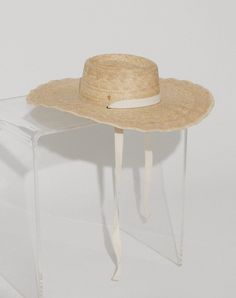 Handmade by artisans in Mexico, our new palm hats are a must-have for the warmer months. Featuring a tightly woven pressed palm design with an intricate scalloped brim, The Cortez Palm Hat is intentionally designed for a day under the sun. Essential yet elevated, this hat comes with both an ivory and black ribbon to accommodate your entire wardrobe. 100% Palm Leaf Ethically Handmade in Mexico Interchangeable ivory and black ribbon Inner elastic band to help with fit Spot / specialist clean SIZE Adjustable Straw Panama Hat With Structured Crown, Adjustable Natural Panama Hat For Garden Party, Natural Color Coastal Boater Hat With Curved Brim, Natural Coastal Boater Hat With Curved Brim, Adjustable Toquilla Straw Sun Hat With Structured Crown, Artisan Boater Hat With Curved Brim For Beach, Coastal Style Natural Boater Hat With Curved Brim, Adjustable Structured Crown Hat For Vacation, Vacation Straw Hat With Structured Crown In Natural Color