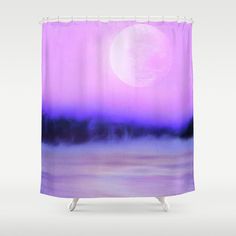 a purple and blue shower curtain with the moon in the background