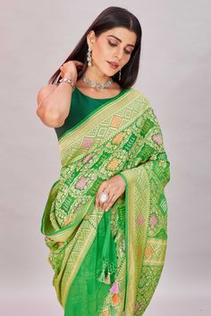 Elegant green georgette Banarasi saree is a perfect choice for festive occasions! It is enhanced with zari minakari jaal and comes with a matching blouse piece. Disclaimer: The shown stitched blouse on the model is for display purpose only. The saree comes with a matching blouse piece and finished with fall and piko. Festive Green Chanderi Pre-draped Saree, Green Semi-stitched Pre-draped Saree With Meenakari, Green Bollywood Pre-draped Saree With Meenakari, Green Blouse Piece With Cutdana For Transitional Season, Green Georgette Pre-draped Saree For Transitional Season, Designer Wear Transitional Green Blouse Piece, Transitional Green Blouse Piece With Cutdana, Festive Pista Green Banarasi Silk Pre-draped Saree, Green Dola Silk Pre-draped Saree For Diwali