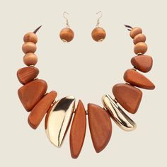 Beautiful Abstract Wood and Metal Statement Necklace.  Necklace comes with matching wood bead drop earrings.   • Necklace Size : 19" + 3.5" L• Decor Size : 3.2" L• Earring Size : 1.7" L• Lead and Nickel Compliant Cheap Tan Statement Jewelry, Lane Woods Jewelry, Luxury Elegant Necklaces With Wooden Beads, Affordable Statement Jewelry With Wooden Beads, Luxury Statement Jewelry With Wooden Beads, Luxury Gold Necklace With Wooden Beads, Bead Drop Earrings, Beaded Drop Earrings, Necklace Necklace