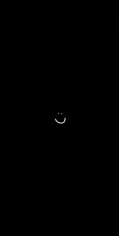 a black background with a smiley face in the middle