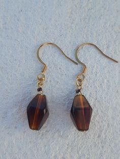 Elegant drop length earrings featuring brown clear glass shaped bead and bronze and gold seed beads. Gold fittings. Drop length measurement is the whole length including the ear wire. Unique Cheap Brown Jewelry, Gold Beaded Drop Earrings, Brown Beaded Drop Earrings For Party, Gold Teardrop Earrings With Round Beads For Gifts, Gold Beaded Long Drop Earrings As A Gift, Long Drop Gold Beaded Earrings As Gift, Gold Beaded Long Drop Earrings, Gold Czech Glass Beaded Earrings For Party, Gold Czech Glass Earrings For Party