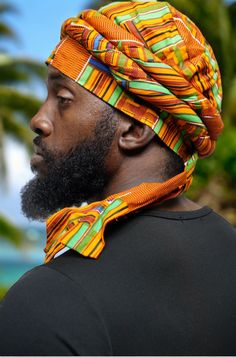 Imagining the vibrant colors of the African landscape, our uniquely crafted 100% cotton Kente Turban, affectionately named "Asase" after the Ghanaian earth goddess, is a true masterpiece by Dupsie's African Fashion. This pre-wrapped Turban in Orange, Green, Black, Off-White, Blue, and Burgundy African Print showcases the rich history and culture of African fashion, securing its place as a must-have accessory for men. The tradition of Turbans in African fashion dates back centuries, symbolizing n Traditional Adjustable Summer Turban, Adjustable Traditional Summer Turban, Traditional One-size Summer Headwrap, Traditional Summer Headwrap One Size, Traditional Multicolor Headwrap With Matching Headband, Traditional Adjustable Multicolor Headwrap, Bohemian Cotton Headwrap For Festivals, Multicolor Turban With Matching Headband, Bohemian Multicolor Cotton Bandana