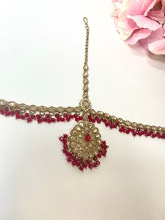 Pretty head chain with champagne zircon crystals, antique gold base and red beads Pendant measures 2 inches.  Ready to be shipped! Bollywood Jeweled Tikka For Festive Occasions, Festive Bollywood Jeweled Tikka, Adjustable Kundan Bollywood Tikka, Adjustable Tikka For Diwali Party, Bohemian Kundan Tikka With Stone Work, Adjustable Bollywood Style Tikka For Parties, Adjustable Bollywood Tikka For Party, Adjustable Stone Work Tikka For Ceremonial Occasions, Adjustable Bollywood Style Ceremonial Tikka