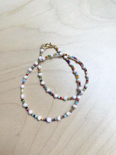 Multi Colored seed bead necklace  Handmade with love and care one at the time in our studio in sunny California  Materials: Glass Beads, nickel free  For custom length please feel free to message us  Fun and flirty. Perfect for summer, concerts, first date, add cuteness to your everyday casual looks. Gift for mom, sister, a friend or yourself💕 Unisex White Beaded Chain Bracelet With Heishi Beads, White Beaded Necklaces With Tiny Beads For Everyday, Everyday White Beaded Necklaces With Tiny Beads, Everyday White Beaded Necklaces With Colorful Beads, White Beaded Necklace With Heart Beads For Festival, Everyday White Beaded Necklace With Tiny Beads, Everyday White Beaded Necklace With Colorful Beads, White Necklaces With Colorful Beads For Friendship, White Beaded Necklaces With Letter Beads For Friendship