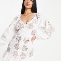 Petite Dress By Asos Design Most Grammable Patchwork Design V-Neck Puff Sleeves Button-Up Front Ruffle Hem Regular Fit Product Code: 114921192 Embroidered White Long Sleeve Mini Dress, White Embroidered Long Sleeve Mini Dress, White Long Sleeve Embroidered Mini Dress, White Embroidered Long Sleeve Dress With Floral Print, White Long Sleeve Embroidered Dress With Floral Print, White V-neck Mini Dress With Broderie Anglaise, White V-neck Embroidered Dress For Brunch, Plisse Dress, Cheetah Dress