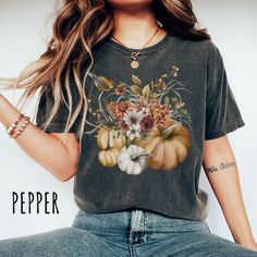 👀Images are an accurate depiction of what you'll receive upon purchase ♂️ All Shirts are Unisex Sizing 👣 Printing is "Direct To Garment"  (Ink printed). Introducing our stunning new Autumn Vibes t-shirt, a delightful fusion of cozy comfort and captivating autumn charm. Our autumn-inspired design captures the essence of the season, with intricately detailed pumpkins that evoke feelings of warmth and abundance. The enchanting autumn foliage adds a touch of natural elegance, depicting the vibrant Short Sleeve Floral Print Tops For Fall, Fall Graphic Tee With Vintage Print, Vintage Floral Print T-shirt For Fall, Casual Cotton Shirt With Digital Print, Fall Season Printed Short Sleeve Shirt, Fall Cotton T-shirt With Vintage Print, Fall Printed Cotton T-shirt, Fall Cotton Printed T-shirt, Printed Cotton T-shirt For Fall