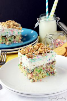 a piece of cake with sprinkles on it is sitting on a plate