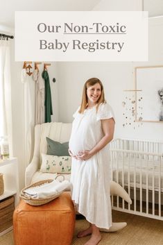 a pregnant woman standing in front of her crib with the words our non - toxic baby register