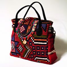 This is a unique handmade product woven on Anatolian carpet and kilim looms. The leather parts are made of genuine leather and the inner parts are made of high quality thick waterproof fabric. It has a 22x15 (8.66x6 inches) zippered compartment inside. Can be used as handbag and shoulder bag. Its large interior volume has the capacity to meet your daily needs.

This kilim bag includes traditional colours of Anatolia. The main figure of this bag called “The Star” in Anatolia. The meaning of the star-shaped rug motif, which is representative of diligence and productivity, lies in the fact that the weaver wants to express that she and her family are hardworking and diligent.

Dimensions:
Width: 40 cm (15,7 inches)
Height: 33 cm (13 inches)
Width: 13 cm (5.1 inches) Shaped Rug, Ethnic Bag, Kilim Bag, Star Motif, The Weaver, Boho Bag, Large Bag, Shoulder Purse, Waterproof Fabric