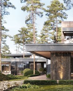 the house is surrounded by trees and grass