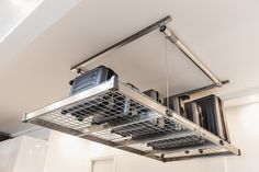 a stove top oven sitting inside of a kitchen next to a wall mounted heater