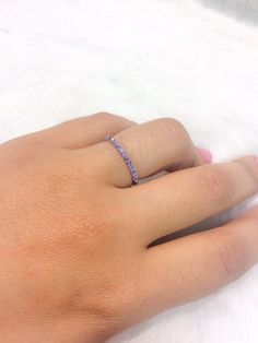 Delicate Natural Amethyst Gemstone Full Eternity Band Ring. 14K Amethyst Pave Full Eternity Band. Material: 14K Solid White Gold Plating: Rhodium Setting: U Micro Pave Set Stone: Diamond Cut Natural Amethyst Carat Weight: 0.53 ct Quantity of Stones: apx 42 (varies by ring size) Quality: AAA Width: 1.7 mm Height: 1.7 mm This kind of Bands are called Round Wire Eternity Bands. These Rings are Full of Elegance and Beauty. They are so Simple and so Complete at the same time! Amethyst's Rich Deep Mag Stackable Gemstone Cubic Zirconia Rings, Cubic Zirconia Gemstone Eternity Band With Round Cut, Fine Jewelry Eternity Band With Birthstone For Promise, Fine Jewelry Birthstone Eternity Band For Promise, Fine Jewelry Birthstone Eternity Band, Cubic Zirconia Gemstone Eternity Band, Stackable Amethyst Promise Ring, Purple Cubic Zirconia Birthstone Ring Round Cut, Promise Amethyst Ring