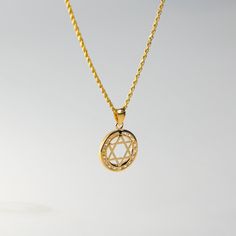 Fall in love with its captivating symmetry. This 14K solid gold handmade star of David pendant is a must-have for anyone who pays attention to even the smallest of details. A quick inspection of the piece will make you admire over the 30 years of experience we bring with every handcrafted pendant we make. This one is no exception as the edges, the points, and its overall appeal genuinely captures the aura of one of the most popular Jewish symbols. Send it as a gift or add it to your collection o Spiritual Yellow Gold Necklace With Star Charm, Symbolic Gold Star Necklace, Yellow Gold Star Of David Necklace, Yellow Gold Star Of David Necklace With Polished Finish, Spiritual Yellow Gold Star Jewelry, Spiritual Yellow Gold Star Of David Necklace, Gold Star-shaped Jewelry With Diamond Cut, Gold Star-shaped Diamond Cut Jewelry, Gold Star Of David Necklace For Anniversary