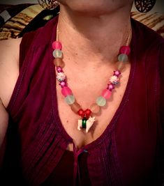 "This is a hand beaded pink glass and frosted rainbow 🌈 candy colored bead necklace with an adorable little Piggy rapped in silk crimson thread. So bright and cute 🥰 Hangs on a 18\" 18k gold plated chain. Please let me know if you would like a cute: ⭐️ Piggy 🐷 Necklace  ⭐️ Elephant 🐘 Necklace ⭐️ Zebra 🦓 Necklace ⭐️ Girrafe🦒 Necklace" Playful Handmade Pink Necklace, Whimsical Pink Beaded Necklaces For Gifts, Whimsical Pink Beaded Necklaces As Gift, Bohemian Pink Jewelry For Birthday, Playful Beaded Chain Necklace For Gift, Pink Beaded Necklace With Tiny Beads For Gift, Playful Beaded Chain Necklace As Gift, Festival Pink Necklaces With Colorful Beads, Whimsical Pink Beaded Necklaces With Round Beads