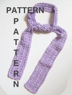 a crocheted purple scarf on top of a white plate with the words pattern written below it