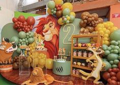 the lion king birthday party with balloons and decorations