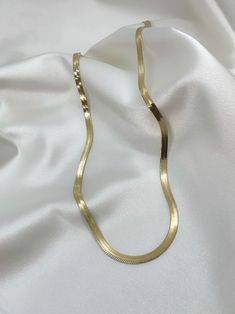 Get the classically elegant look of herringbone designs with the Premium Herringbone Necklace. This gorgeous 18-inch-long necklace is fashioned out of stainless steel and plated with 14 karat gold to give it an opulent appearance. It is both hypoallergenic and tarnish-free for comfortable wear and a long life. - Elegant 14 karat gold-plated stainless steel necklace - Water resistant to avoid moisture damage - Hypoallergenic - Resistant to tarnishing Elegant Metal Herringbone Clavicle Necklace, Elegant Herringbone Clavicle Necklace, Gold Minimalist Herringbone Necklace, Gold Minimalist Herringbone Necklace For Formal Occasions, Gold Minimalist Herringbone Necklace As Gift, Gold Minimalist Herringbone Necklace Gift, Elegant Gold-tone Herringbone Necklace Gift, Herringbone Necklace With Lobster Clasp As Gift, Herringbone Necklace With Lobster Clasp For Gifts