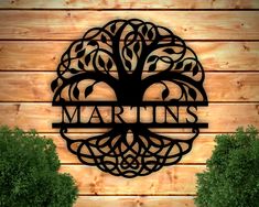 a metal sign that reads martin's on the side of a wooden wall with trees