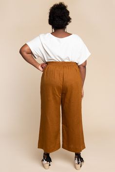 Part of our Rome Collection, the Pietra Pants & Shorts are the best of both worlds; a flat front, high-waisted silhouette with the comfort of an elastic waist in the back. Featuring lengthening panels in the front with slanted hip pockets and a hidden waist stay, you'll never want to take them off. Choose between four leg styles: a wide leg in floor-skimming or cropped length (View A), a slim and tapered leg (View B), or gently flared shorts (View C). Skill Level: 2 of 5 Sizes: 0 to 20 New, Pietra Pants, Flared Shorts, Closet Core Patterns, Trouser Pattern, Garment Pattern, Best Of Both Worlds, Shorts Pants, Pants Pattern, Slim Pants