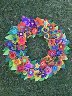 a colorful wreath made out of paper flowers