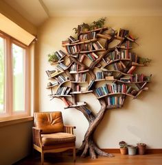 a tree shaped bookshelf in the corner of a room