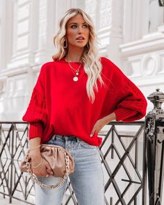 Our braided sleeve sweater is a x'mas red tone in a lovely relaxed fit. This snug knit is sure to keep you warm as it features a high neckline and drop-shoulder long sleeves. Pair with jeans for a lazy day outfit. Size Guide: Ambre is 5’2” tall, and has a 33.2” bust, 24.5”waist, & 36.7” hips. She is wearing a S / US 4 / AU 8. This sweater is true to size. Feature: Relaxed fit. Unlined. Crew neckline. Braided sleeve details. Material: 100% Acrylic. Care Instructions: Machine wash / Cold hand wash Red Knit Tops With Ribbed Cuffs, Red Winter Sweater With Ribbed Cuffs, Red Soft Knit Turtleneck Sweater, Trendy Red Turtleneck Sweater, Cozy Red Sweater With Ribbed Cuffs, Red Cable Knit Crew Neck Sweater, Red Soft Knit Crew Neck Sweater, Red Oversized Soft Knit Sweater, Red Textured Knit Crew Neck Sweater