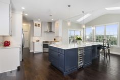 a large kitchen with an island in the middle