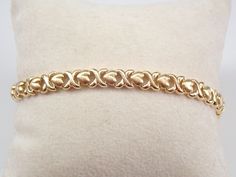 Vintage Solid 14K Yellow Gold Bracelet. This bracelet weighs 9.6 grams, measures 6 mm in width and fits a standard lady's wrist (measures 7"). This bracelet will be accompanied by an appraisal by a GIA Certified Diamond Grader with the retail replacement value of $1,685.00. I will ship this bracelet promptly in a gift box. Hearts And Kisses, Pandora Bracelet Charms Ideas, Vintage Gold Bracelet, Gold Hearts, Bracelet Simple, Bracelet Charms, Pandora Bracelet Charms, Yellow Gold Bracelet, Pandora Bracelet