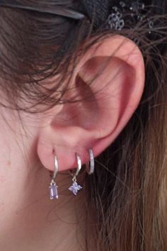 These sweet earrings are both glam and perfect for everyday wear.

>> Lilac Flower Huggies: https://pinealvisionjewelry.com/products/lilac-flower-huggies Delicate Silver Tarnish Resistant Huggie Earrings, Delicate Silver Huggie Earrings Tarnish Resistant, Elegant Tiny Dangle Hoop Earrings, Elegant Purple Earrings For Everyday, Elegant Tiny Silver Huggie Earrings, Hypoallergenic Lavender Sterling Silver Jewelry, Hypoallergenic Lavender Jewelry, Dainty Purple Jewelry With Matching Earrings, Fine Jewelry Lavender Earrings As Gift