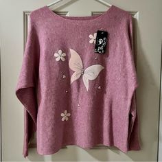 Cute And Comfy Lilac/Pink Butterfly Sweater With Pearl And Rhinestone Embellishments! Sleeves Are Larger At The Armpit Area For A Loose Fit Look. 100% Viscos, One Size. Nwt Condition. *Second To Last Picture Shows Pink Version Of Sweater *See Last Picture For Other Color Options Measurements: Shoulder To Hem - 22in Sleeve - 19in Armpit To Armpit - 20in Large Knit Sweater, Pink Cashmere Sweater, Butterfly Sweater, Purple Crewneck, Abercrombie (women), Victoria Secret Pink Sweatshirts, Black Long Sleeve Sweater, Pointelle Sweater, Lilac Pink