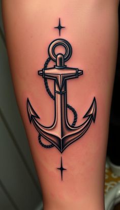 an anchor tattoo is shown on the leg