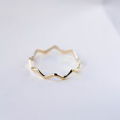 A dainty gold ring with zig zag pattern. A stacking gold ring for women, minimal and simple that adds glam to every outfit. This stacking wavy band can be used a an alternative wedding band as well. The best gift for her. 100% handcrafted with love! D E T A I L S ● Metal: 14K solid gold, 14K white gold or 14K rose gold R I N G ∙ S I Z I N G For General Reference: ● we use standard US Ring Sizing ● an average women's ring finger is size 6-7 ● each ring is custom made upon order, in any desired si Adjustable Wavy Stackable Jewelry, Adjustable Stackable Wavy Jewelry, Minimalist 14k Gold Wavy Jewelry, Gold Wavy Promise Ring, Gift Wavy Stackable Rings, Gift Stackable Wavy Rings, Minimalist Wavy Yellow Gold Jewelry, Yellow Gold Wavy Ring For Anniversary, Anniversary Yellow Gold Wavy Rings