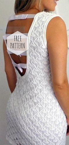 the back of a woman's white lace dress