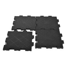 four pieces of black plastic flooring