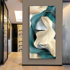 an abstract painting hangs on the wall in a hallway