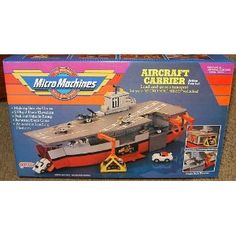 a box with a model of an aircraft carrier in it