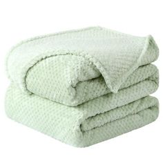 three white towels stacked on top of each other